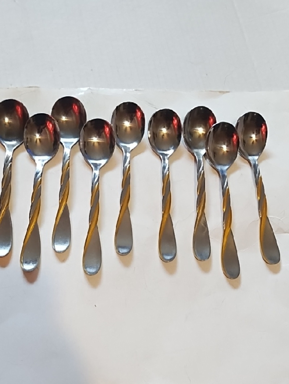 Set of 9 Twisted Handle Stainless Steel Spoons with Gold Accent